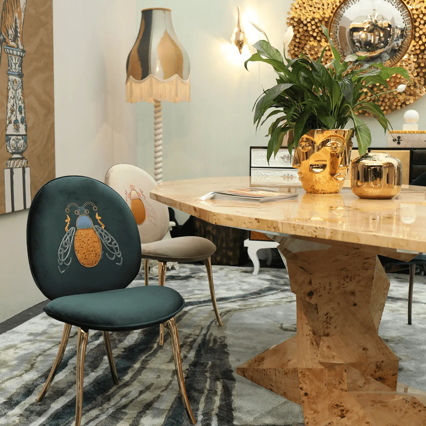 Bonsai Poplar Root Dining Table styled in a modern, eclectic dining room with gold accents and decorative decor.