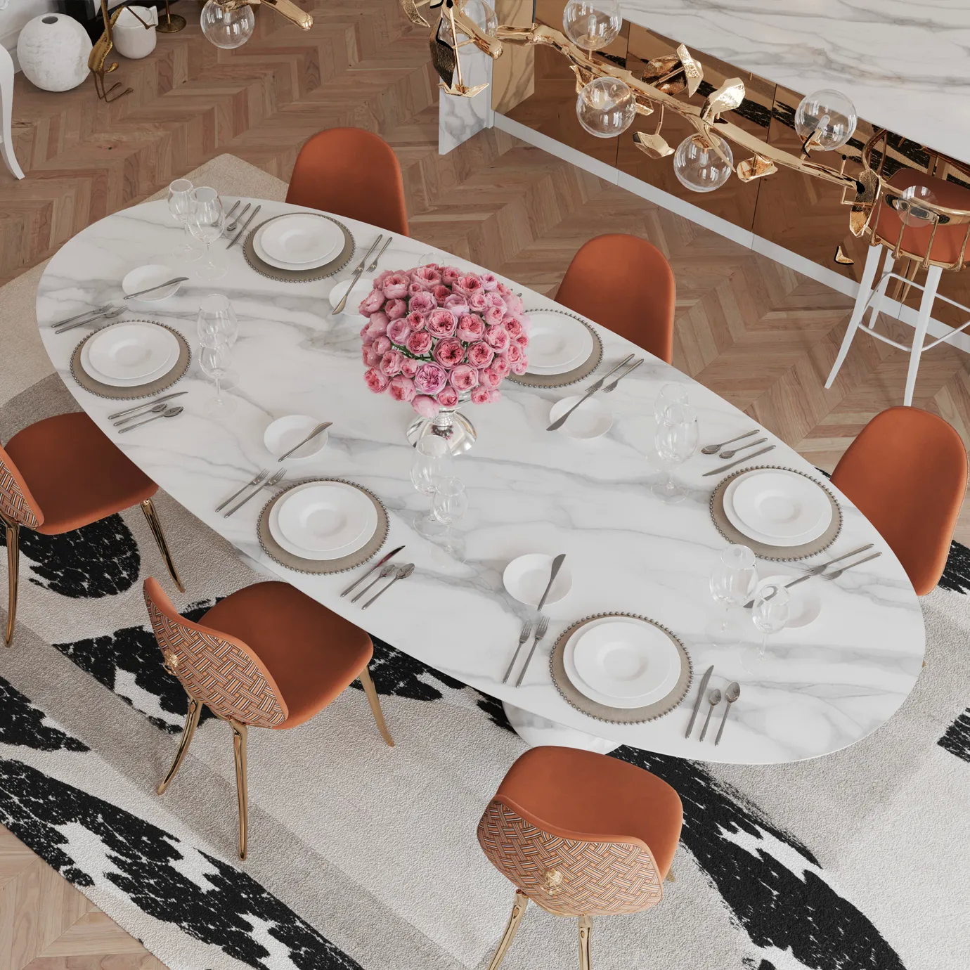 Top-down view of Pietra Oval XL Estremoz Dining Table in a luxury dining room with elegant decor and soft lighting.