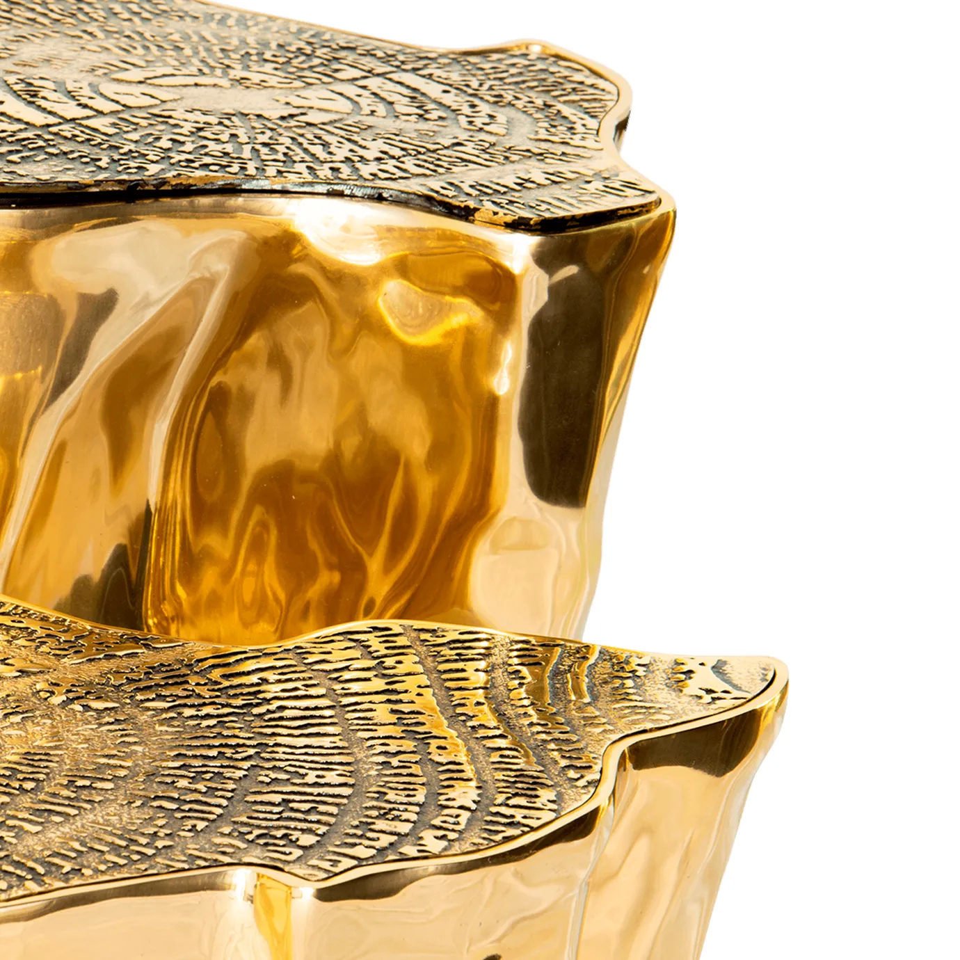 Close-up of the luxurious Eden Center Table, highlighting its textured golden surface.