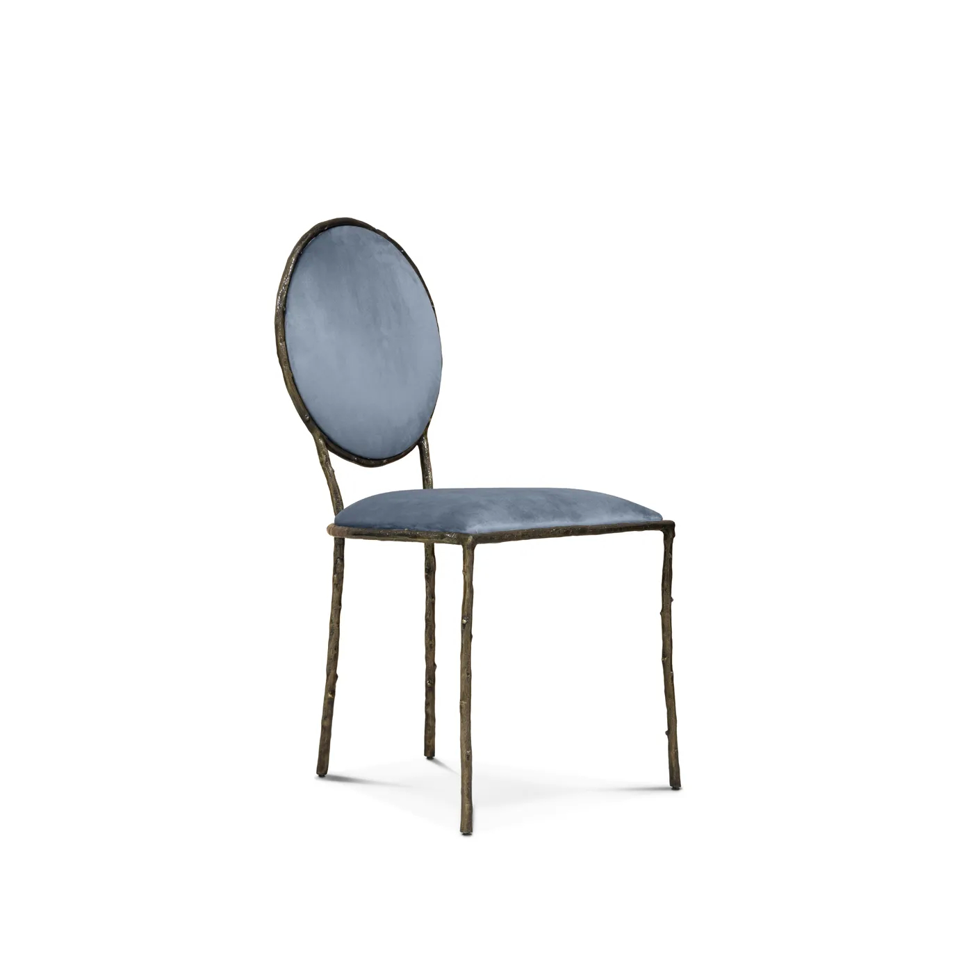 Slight side view of the Enchanted Dining Chair, showcasing its aged brass frame resembling branches, combining with the luxurious blue upholstery.