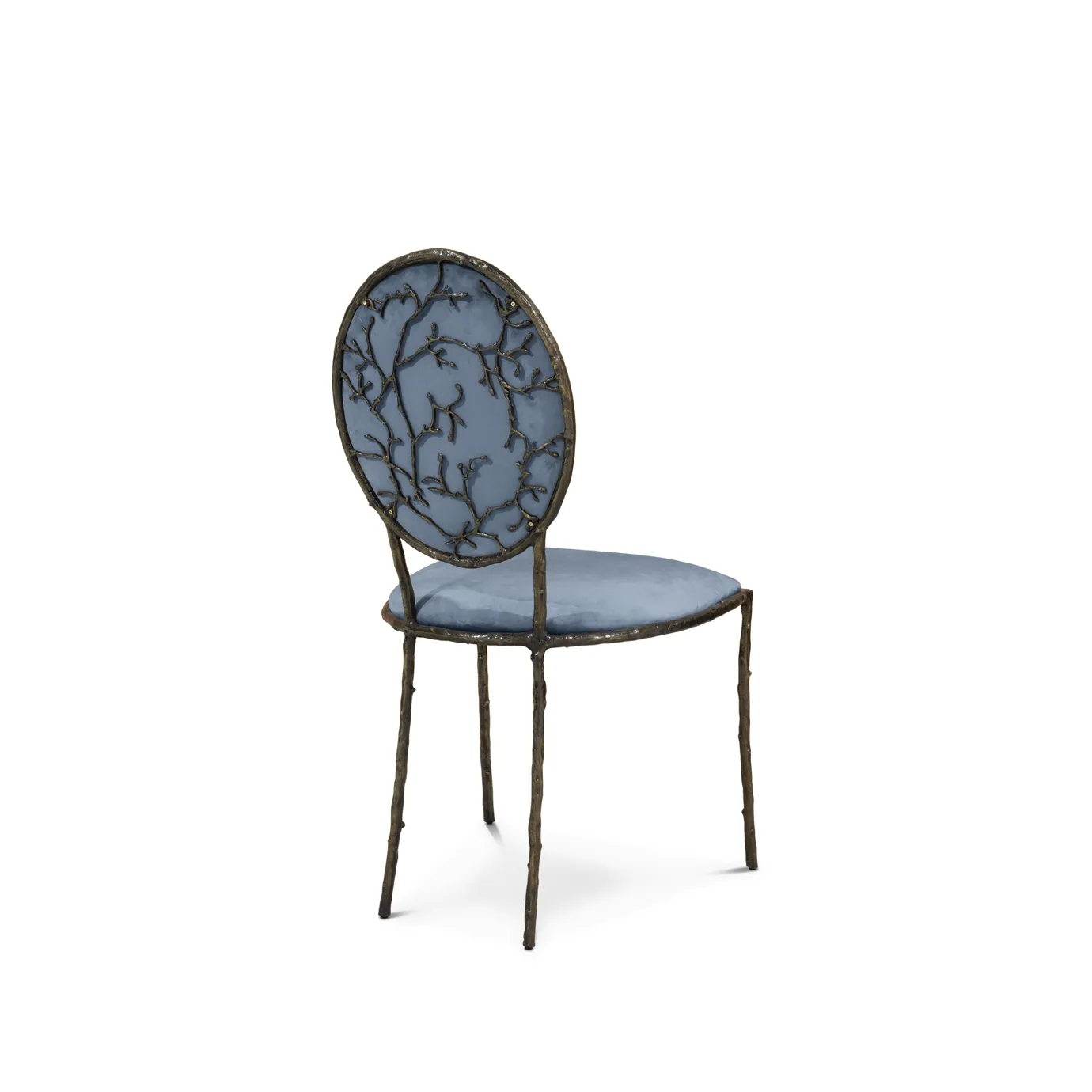 Enchanted Dining Chair: with an elegant backrest resembling branches, this chair has a luxurious blue upholstery.