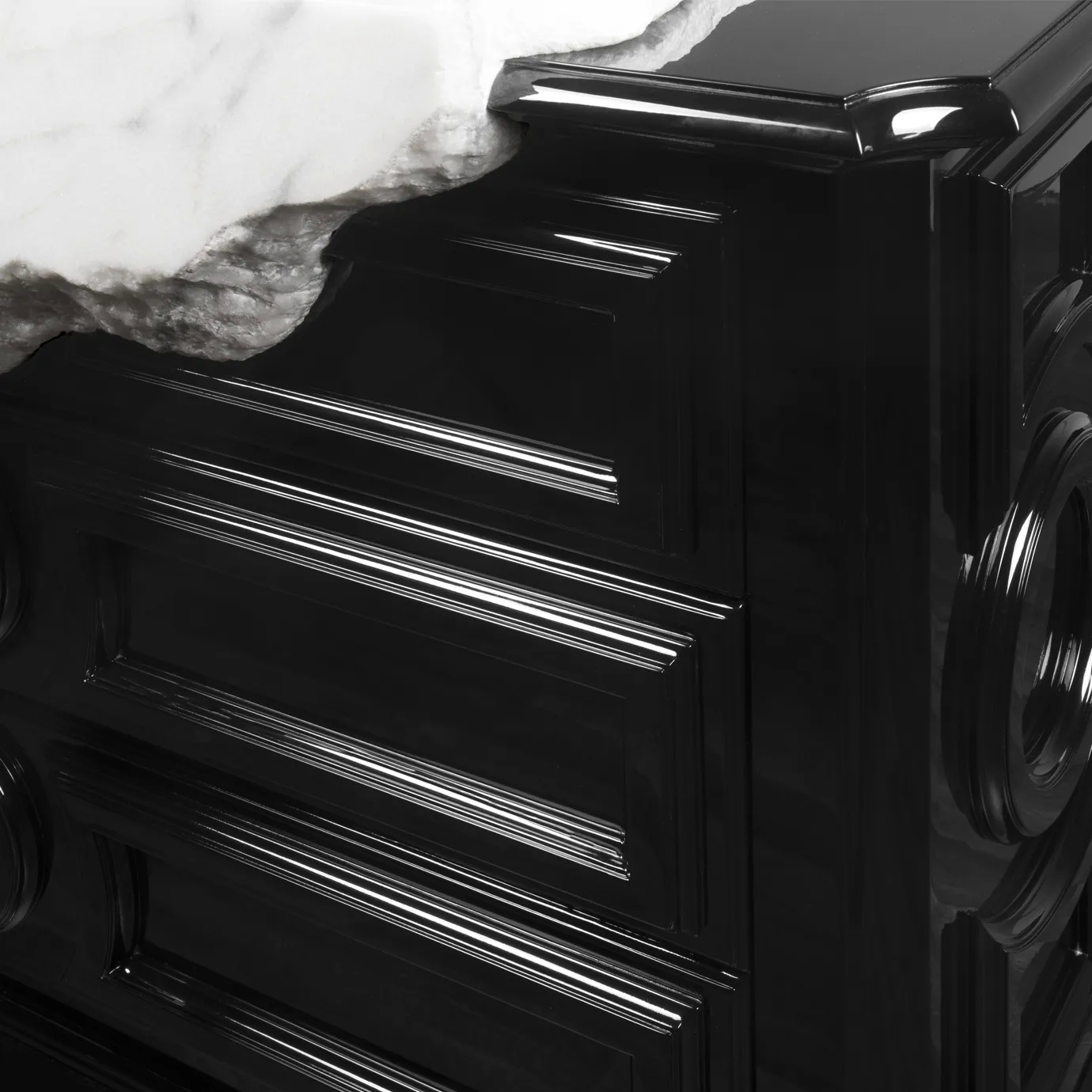 Close-up of Petra vanity cabinet drawers, highlighting mirrored surfaces and elegant gold detailing.