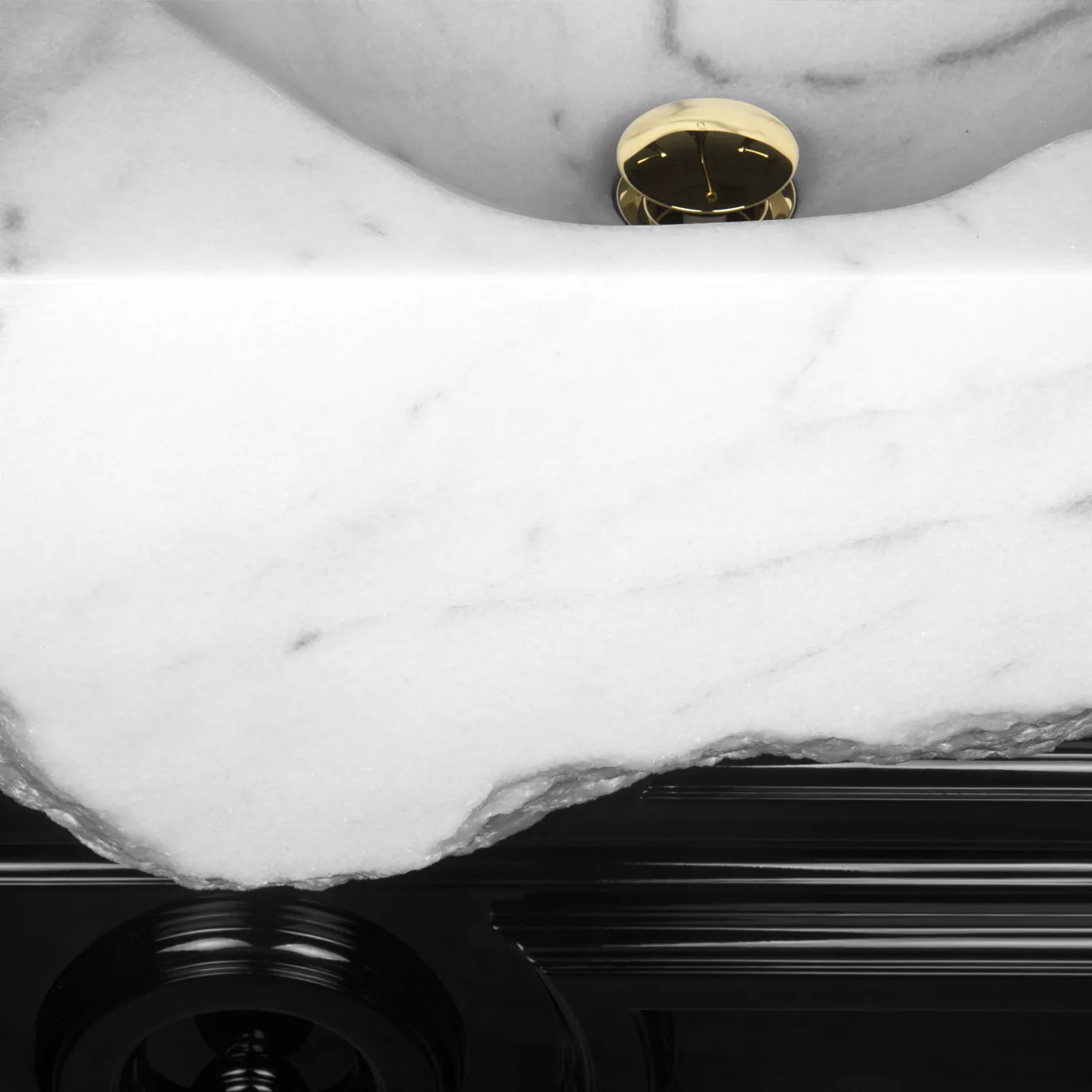 Close-up detail of Petra vanity cabinet, showcasing the sleek black finish and luxurious gold hardware.