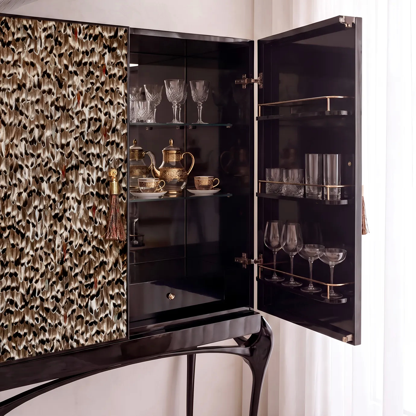 Temptation bar cabinet by KOKET open, black lacquer interior with glass shelves, crystal glassware and brass stemware rails.