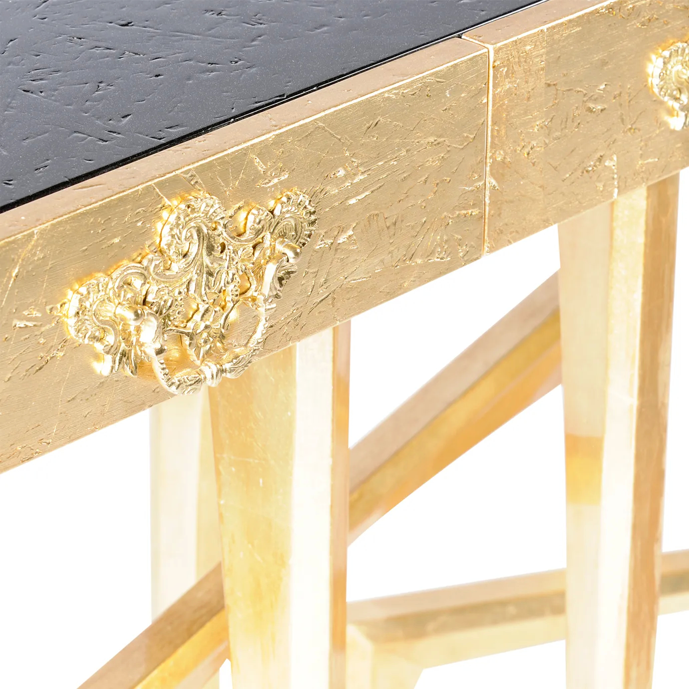 Side view of the sleek Metropolis console featuring a polished black surface and sophisticated gold detailing.