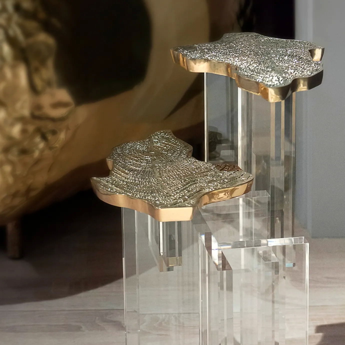 Side view highlighting the luxurious marble top and the detailed, organic gold base.