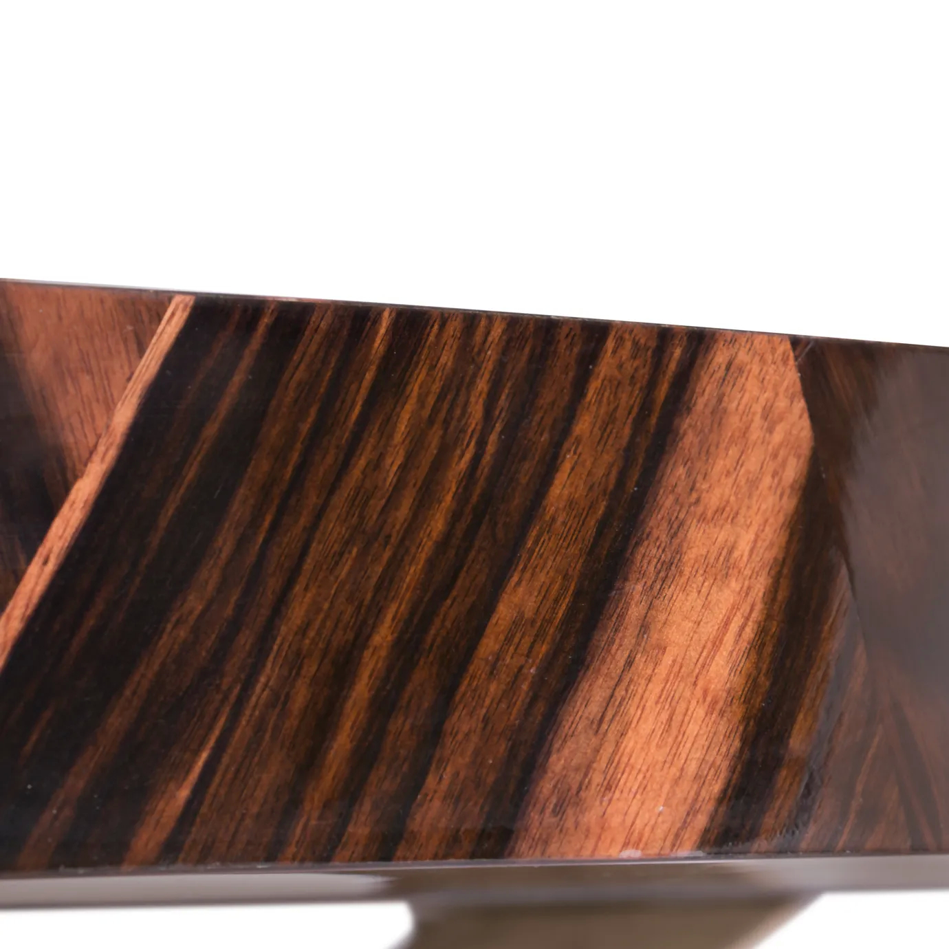 Patch Dining Table with geometric veneer top and sculptural oak base, finished in high gloss.