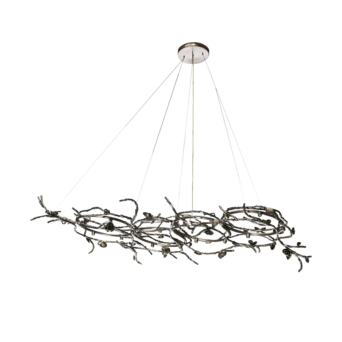 Rose Chandelier in aged brass with sculptural vine-like branches and delicate bud details, suspended by thin cables in a modern interior setting.