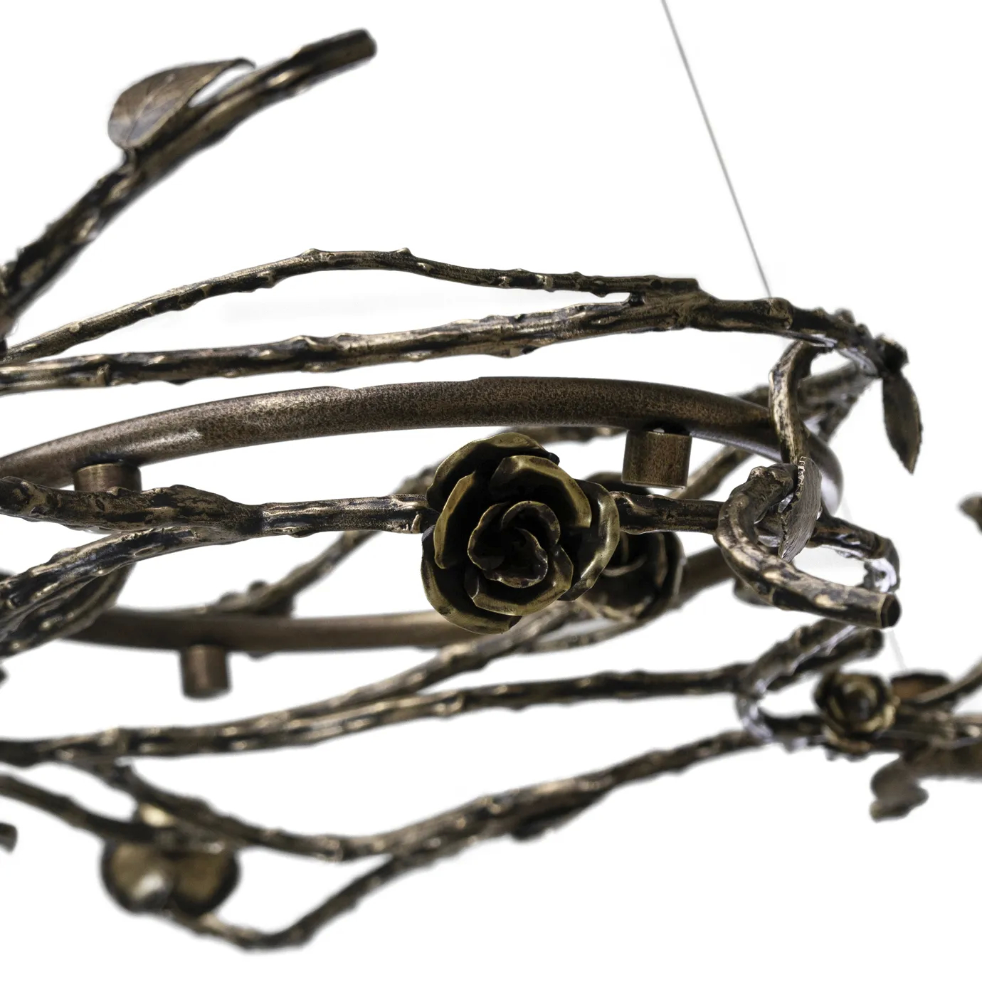 Rose Chandelier in aged brass with intricately crafted branches, leaves, and rose-shaped details, featuring circular frames with small bulbs in an ornate, nature-inspired design.