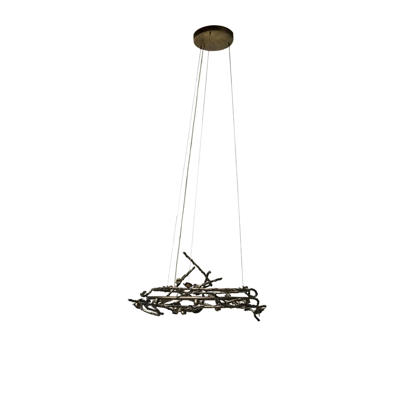 Rose Round Chandelier in aged brass with sculptural branches, metallic leaves, and rose-shaped accents, suspended by thin wires in a modern interior.