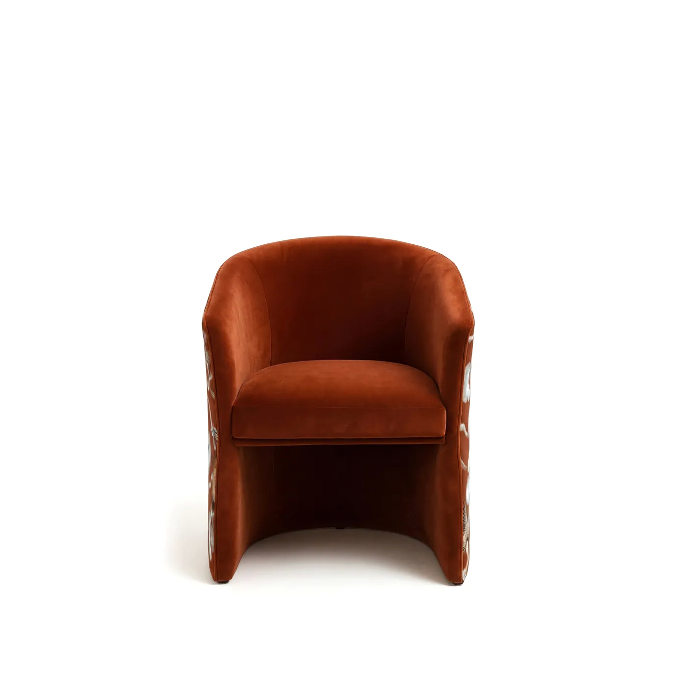 Curved velvet armchair in reddish-brown with cloud-patterned side panel in white, gray, and blue tones; sleek, legless silhouette with sculptural, contemporary design.