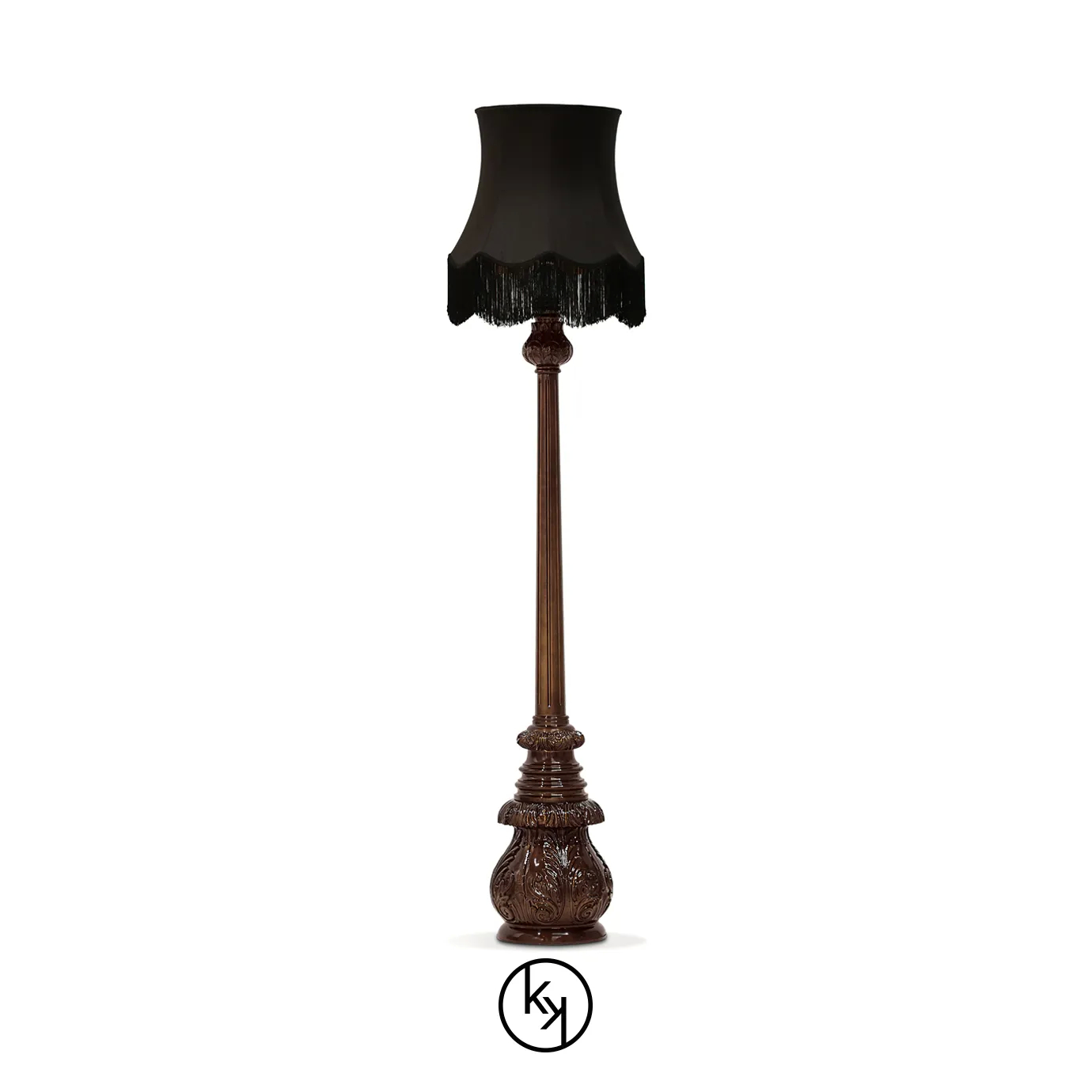 Elegant Lotus Floor Lamp with an ornate sculpted base in brown tones, a decorative vertical stem, and a black lampshade with fringe details.