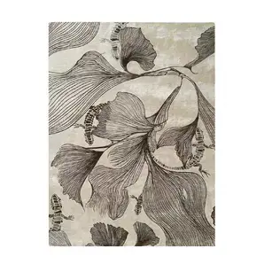 Full view of KOKET Flora rug in sepia and cream tones. Luxury area rug with artistic ginkgo leaf patterns and reptile-inspired details in bronze silk-like texture.