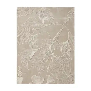 KOKET Flora luxury rug in a monochromatic nude palette. High-end hand-tufted rug with 3D botanical relief and ginkgo leaf pattern for contemporary neutral interior design.