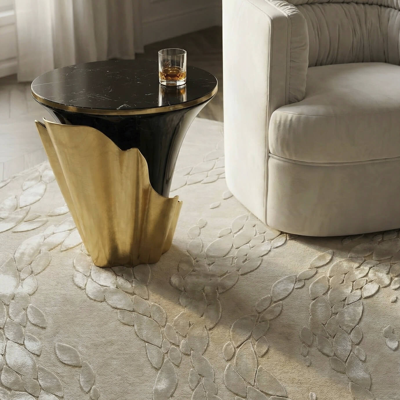Close-up of a neutral KOKET relief rug styled with a luxury black marble and gold side table, highlighting the soft texture and organic pattern