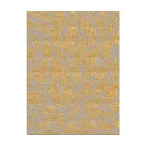 Overhead view of the KOKET luxury rug in grey and gold, featuring a stylized mosaic leaf pattern with shimmering metallic accents