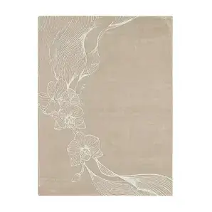 Minimalist KOKET Orchid rug in a soft cream palette with white floral line art, showcasing a delicate and elegant orchid design for luxury bedrooms.