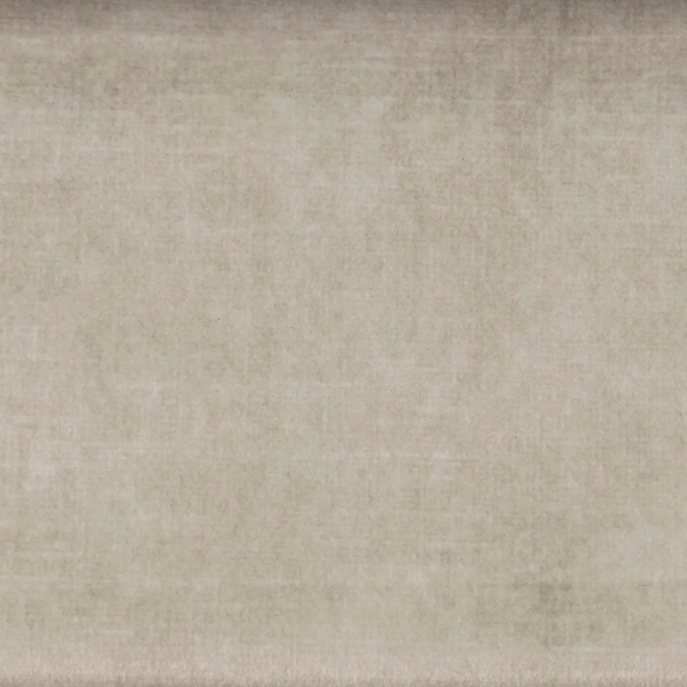 Close-up of Firenze luxury textile by KOKET, featuring a smooth, matte velvet texture in a sophisticated taupe-beige hue for high-end upholstery and interior accents.