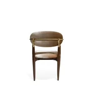 Nahéma Chair by KOKET back view showing two symmetrical cast brass hand details on handcrafted walnut frame