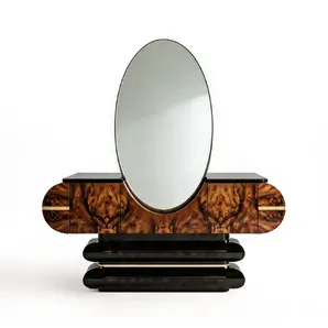 Elsa console table by KOKET, oval mirror over walnut burl body with brass handles and stepped black lacquer base, front view.