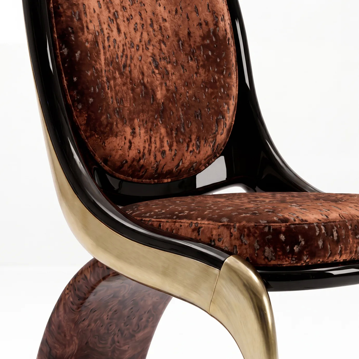 Detail of Gabrielle dining chair by KOKET, rust mottled velvet in a black lacquer frame meeting brushed brass and walnut burl.