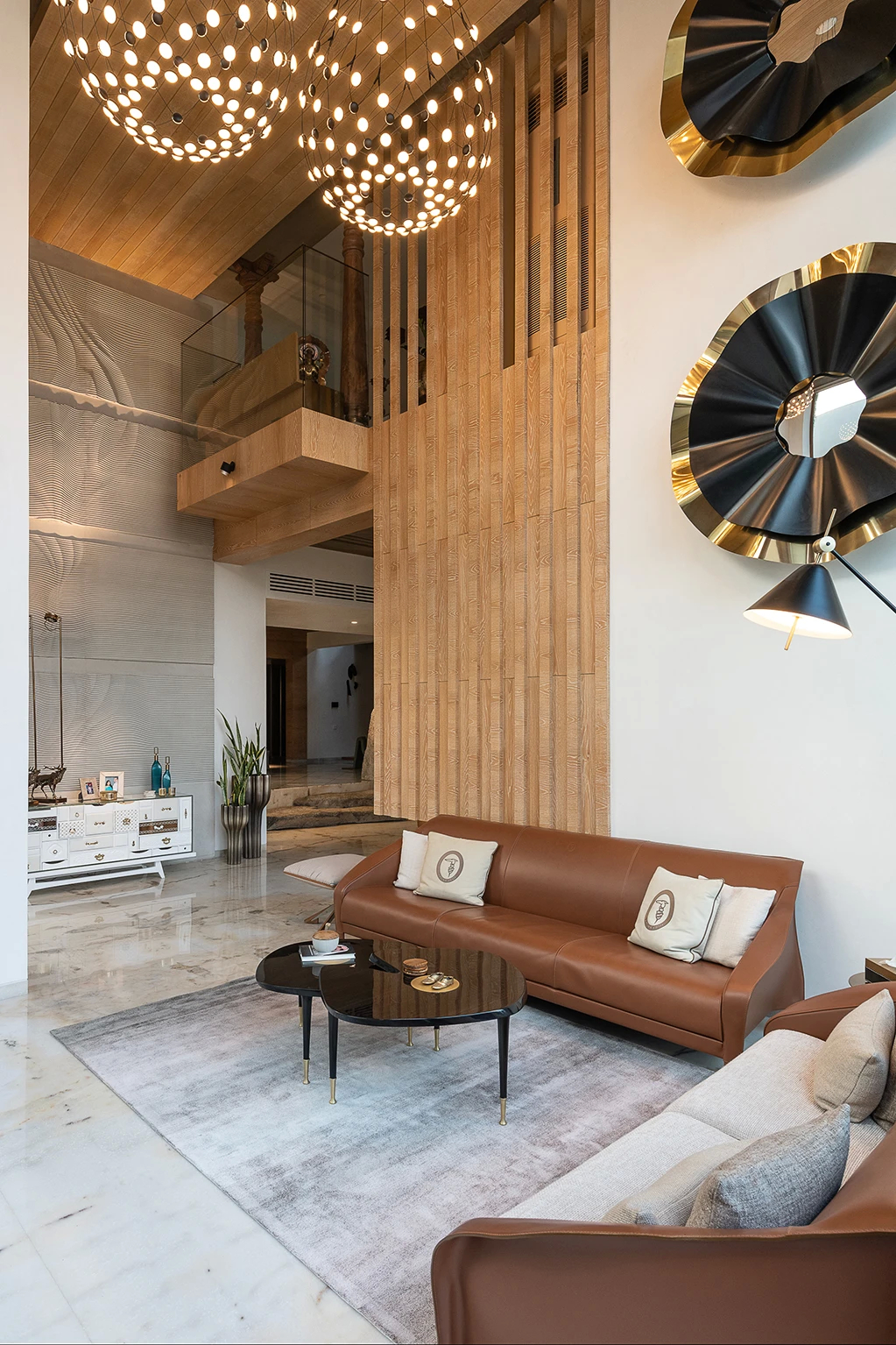 Grand Meets Green: Luxurious living space with a brown sofa, modern lighting, and a Revê 2-Tier Mirror.