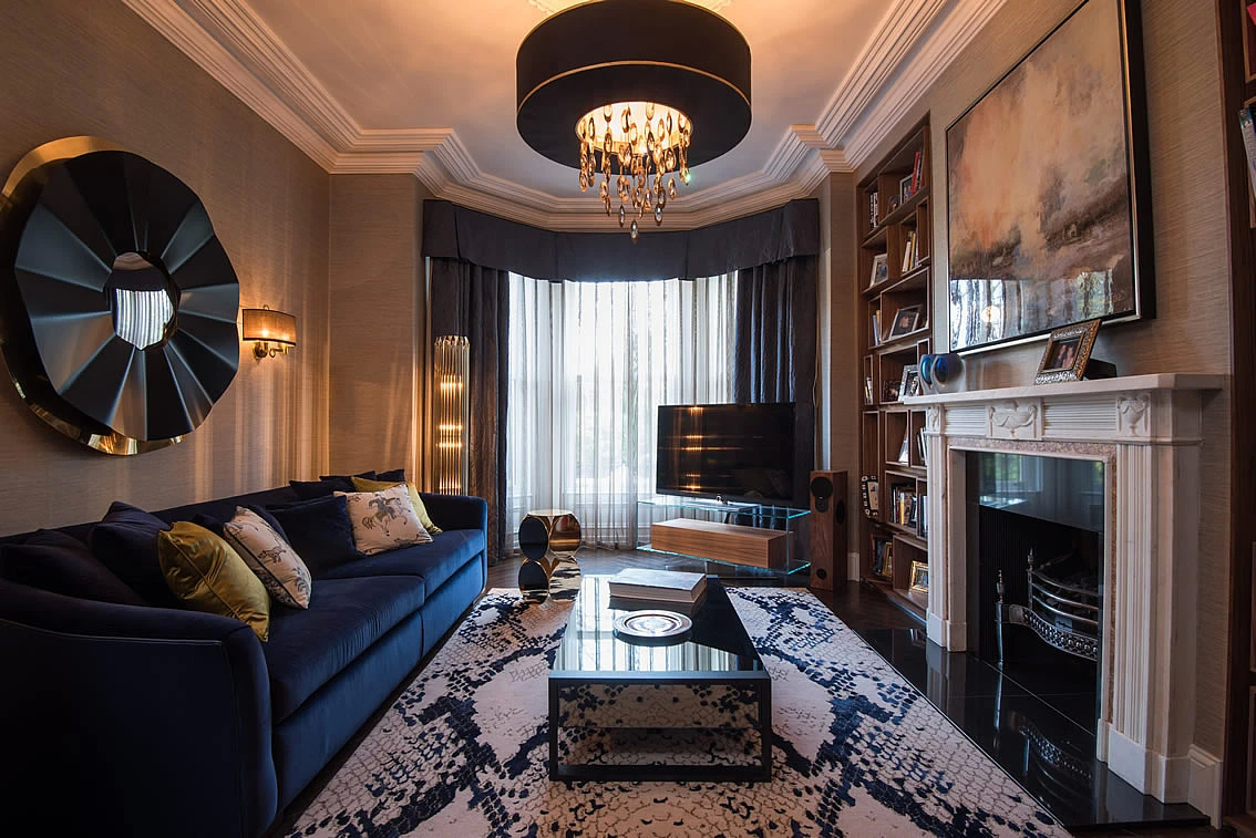 Elegant Malone Park living room featuring a plush navy sofa, stylish decor, and a striking Revê 2-Tier Mirror.