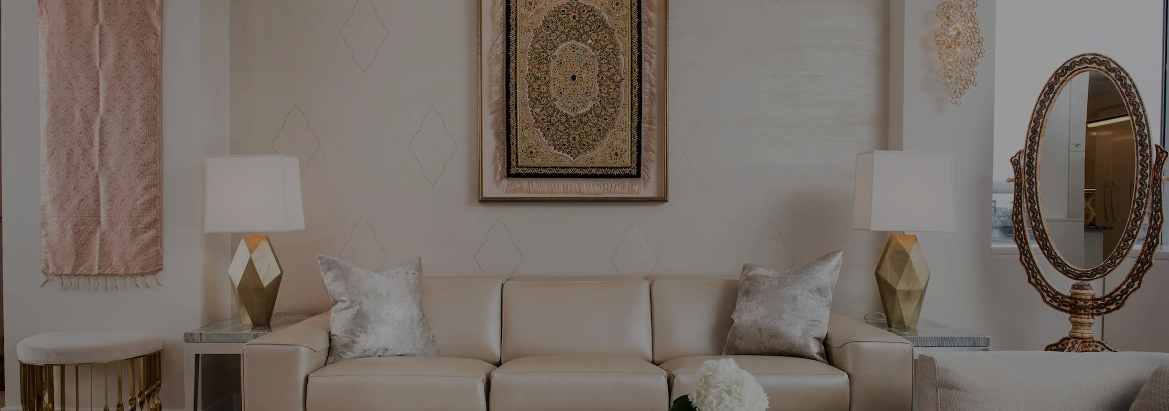 Labor of Love: Two Naomi chairs with golden velvet upholstery and black legs, with a decorative glass vase.