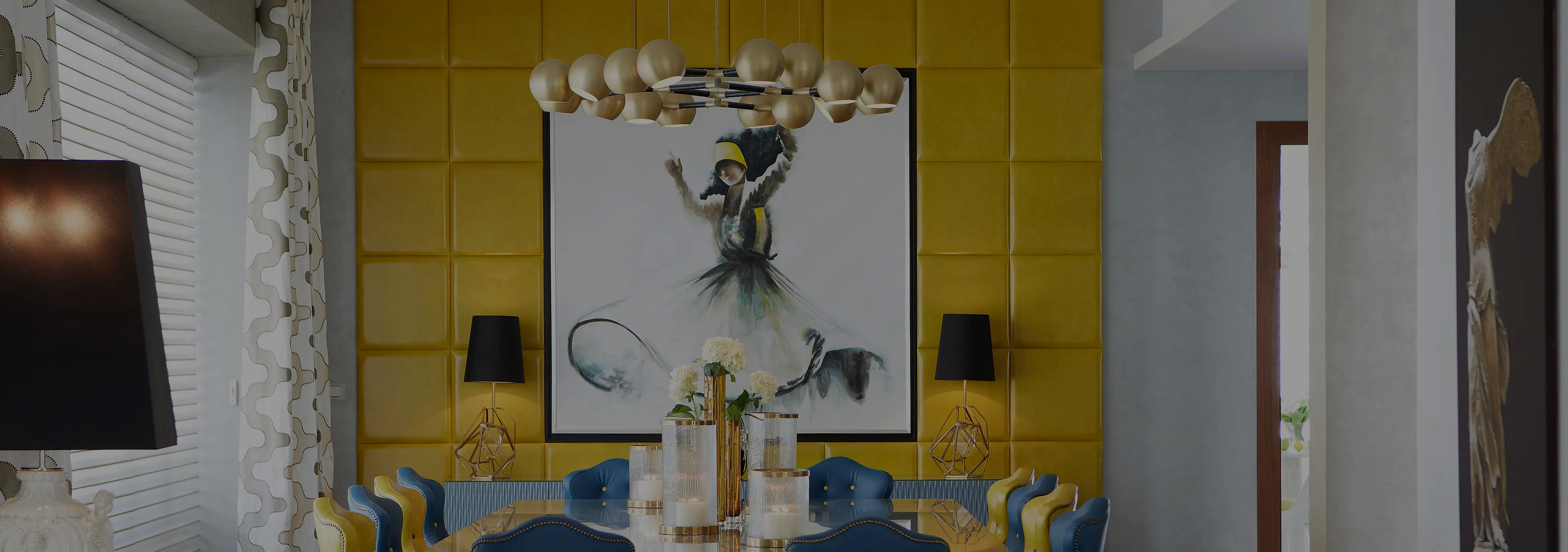 Labor of Love: Two Naomi chairs with golden velvet upholstery and black legs, with a decorative glass vase.