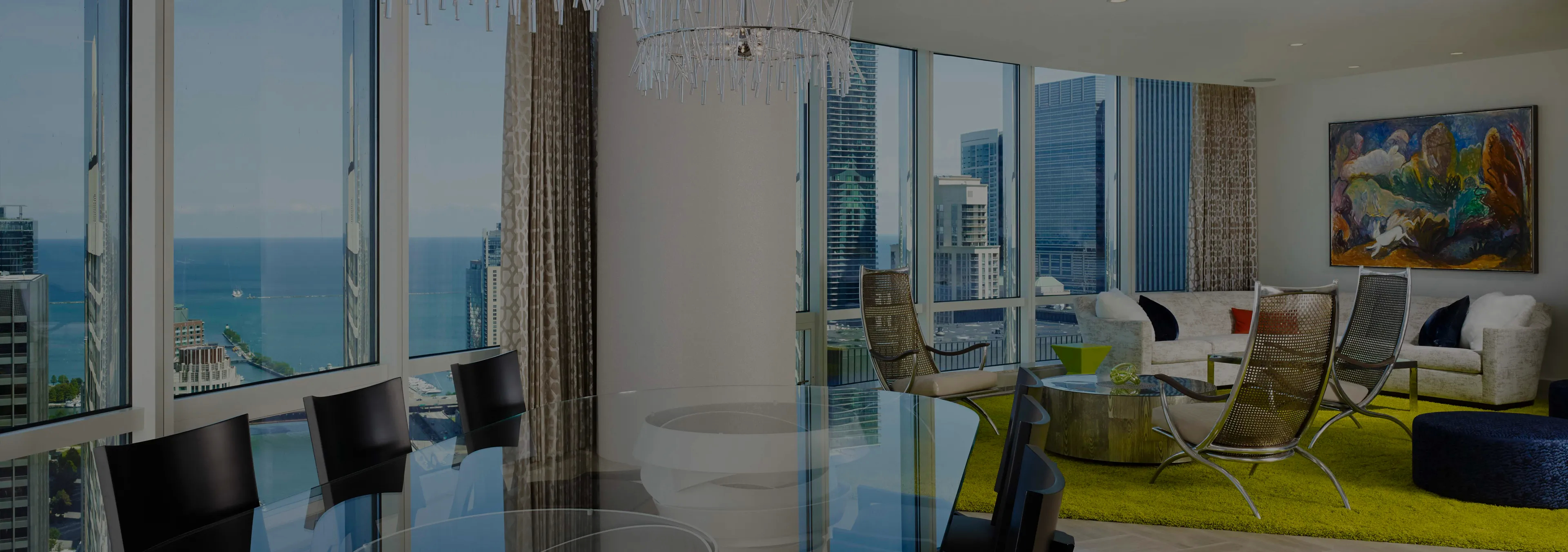 Labor of Love: Two Naomi chairs with golden velvet upholstery and black legs, with a decorative glass vase.