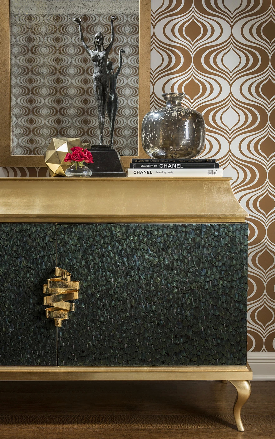 A luxurious cabinet featuring Koket's custom Divine Peacock Feather Armoire, a statement piece in the Private Residence project.