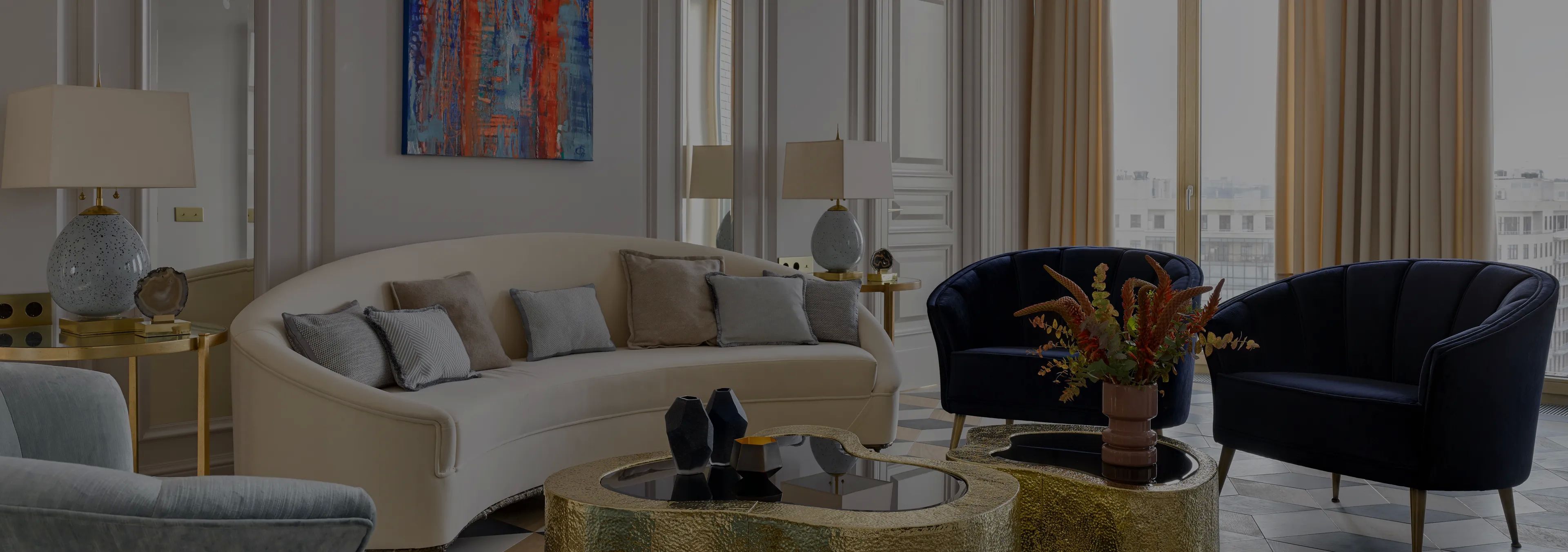 Labor of Love: Two Naomi chairs with golden velvet upholstery and black legs, with a decorative glass vase.