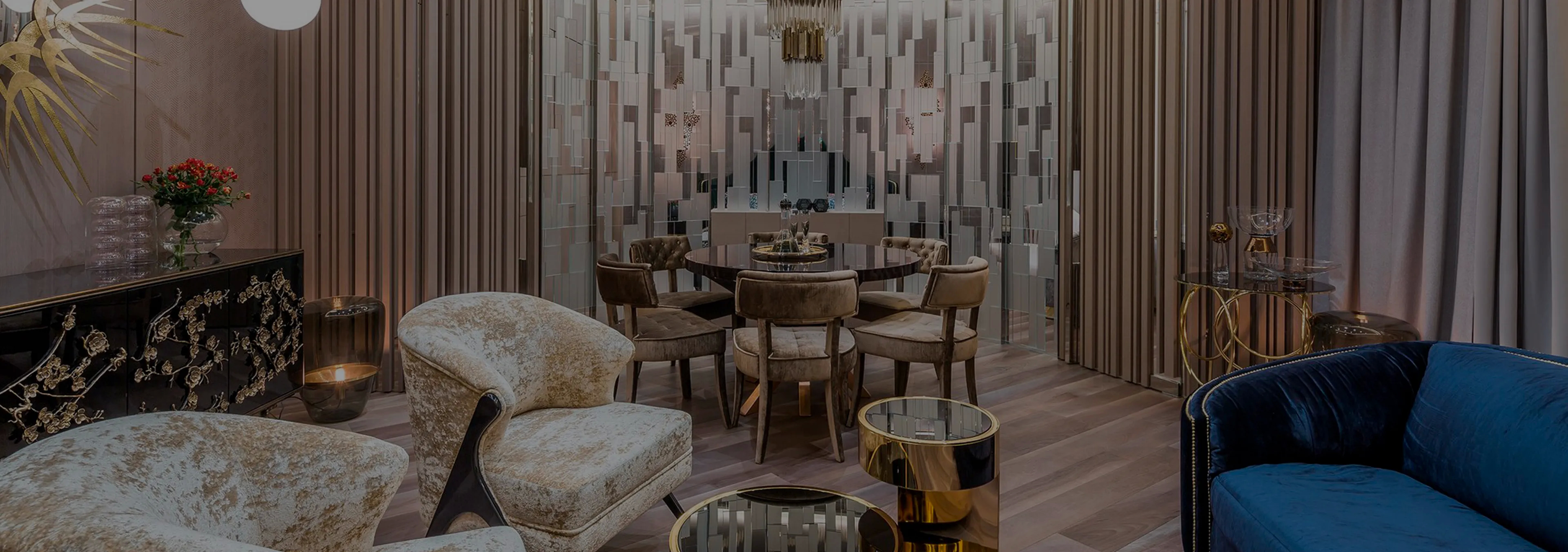 Labor of Love: Two Naomi chairs with golden velvet upholstery and black legs, with a decorative glass vase.