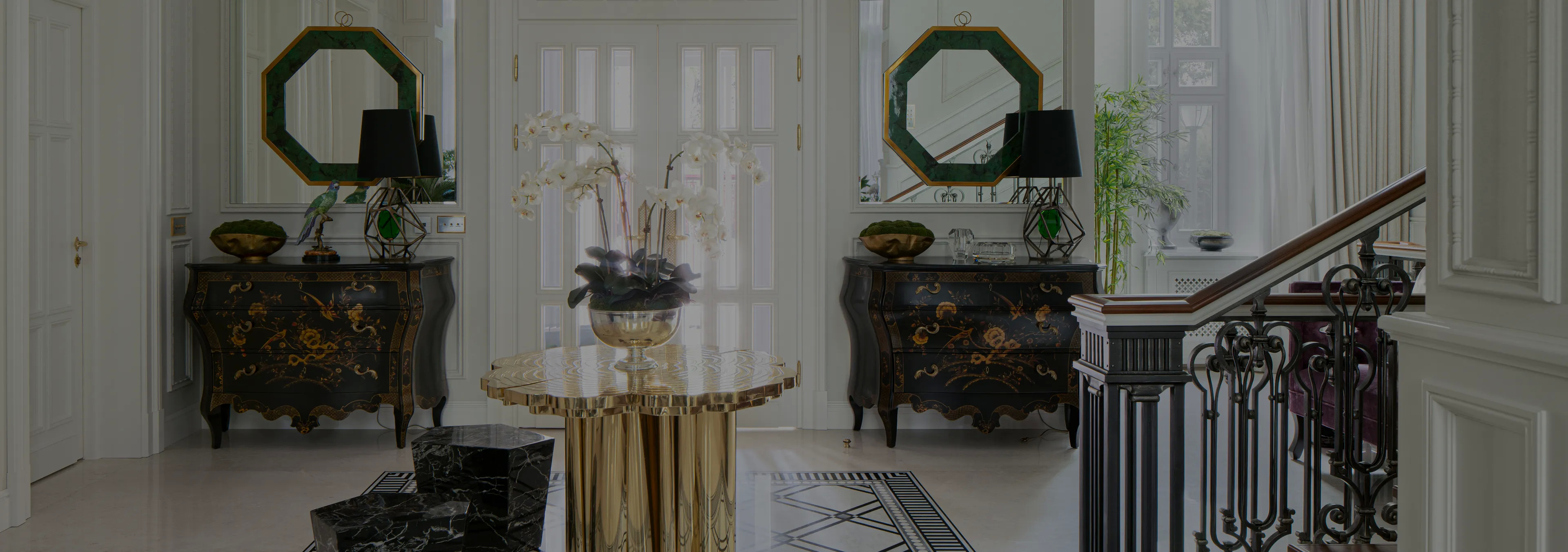 Labor of Love: Two Naomi chairs with golden velvet upholstery and black legs, with a decorative glass vase.