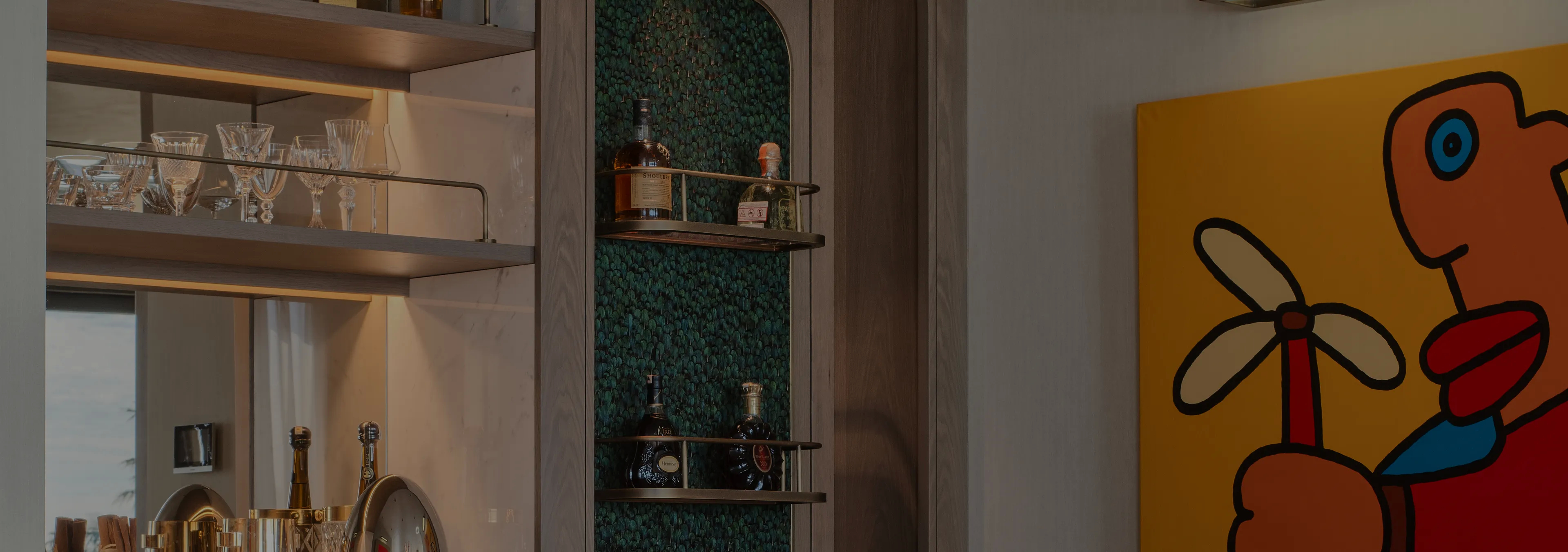 Labor of Love: Two Naomi chairs with golden velvet upholstery and black legs, with a decorative glass vase.