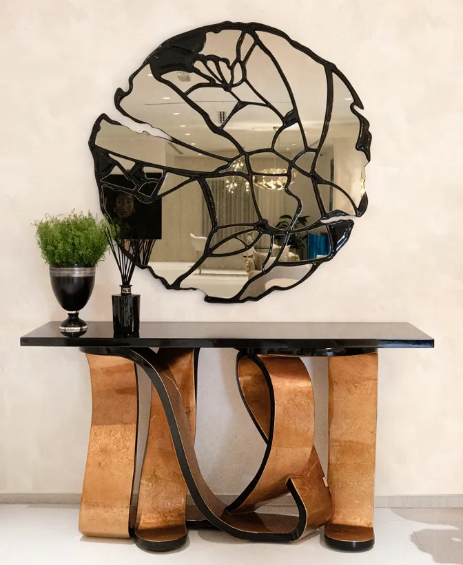 Sculptural console and mirror at the Dubai showroom