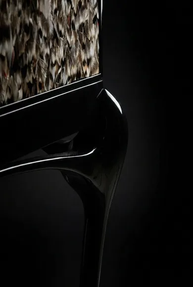 Sculptural curved base of the Temptation cabinet