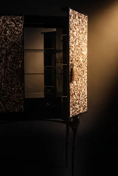 Polished brass interior of the Temptation cabinet