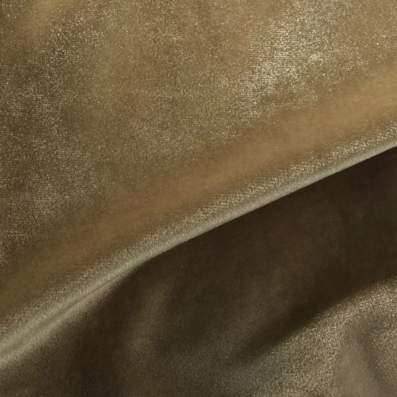 Elegant close-up of a Silky Velvet 427 fabric swatch in a light and luminous brown tone with a soft sheen, showcasing its smooth texture and the delicate folds that highlight its elegance.