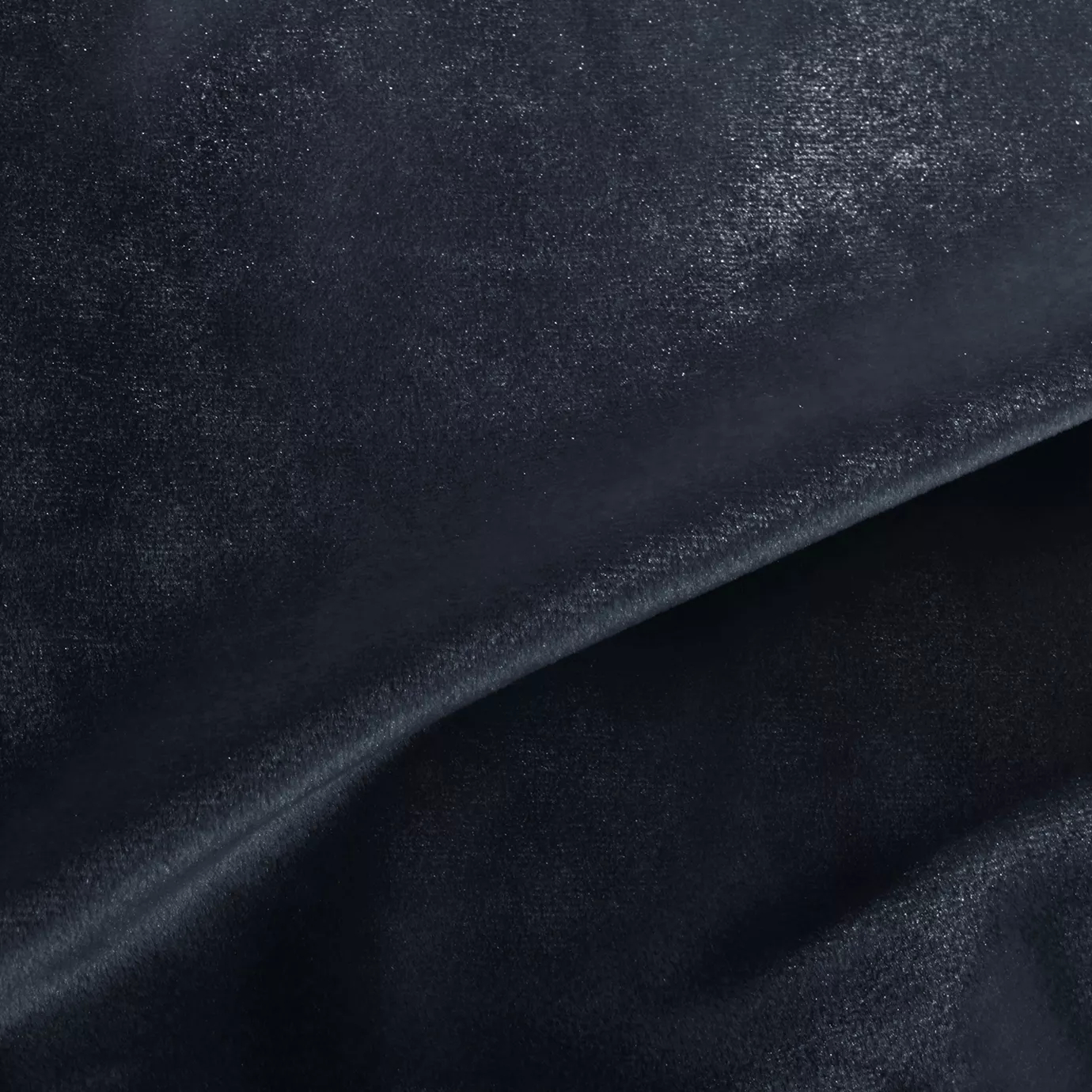 Elegant close-up of a Silky Velvet 431 fabric swatch in a deep and luminous navy blue tone, showcasing its smooth texture and the delicate folds that highlight its intense and silky sheen.