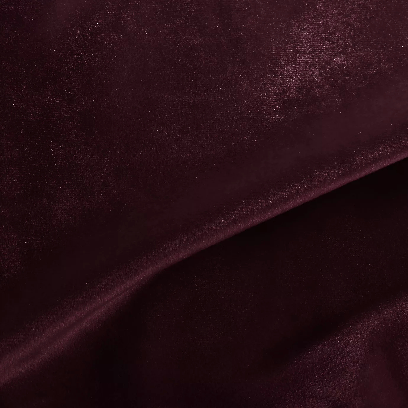 Elegant close-up of a Silky Velvet 432 fabric swatch in a luminous and deep red wine tone, showcasing its smooth texture and the delicate folds that highlight its intense and silky sheen.