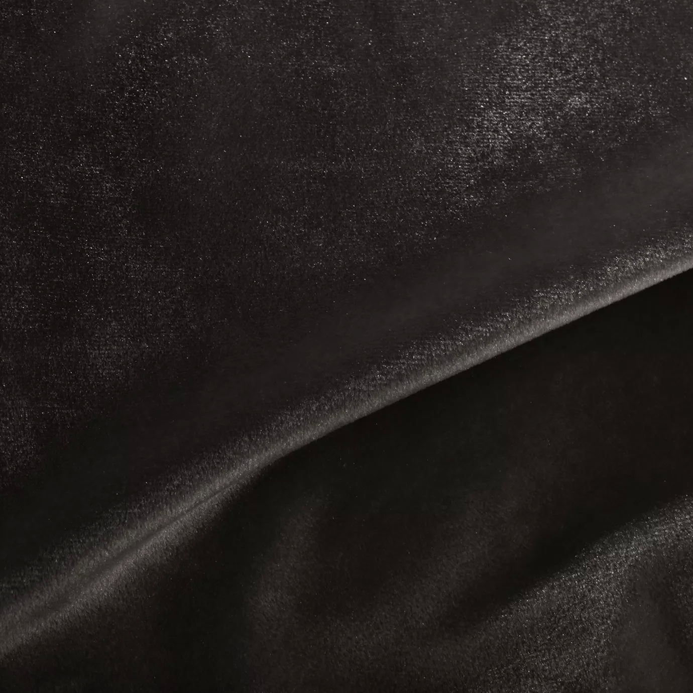 Elegant close-up of a Silky Velvet 477 fabric swatch in a luminous and soft dark brown tone, showcasing its smooth texture and the delicate folds that highlight its deep elegance.