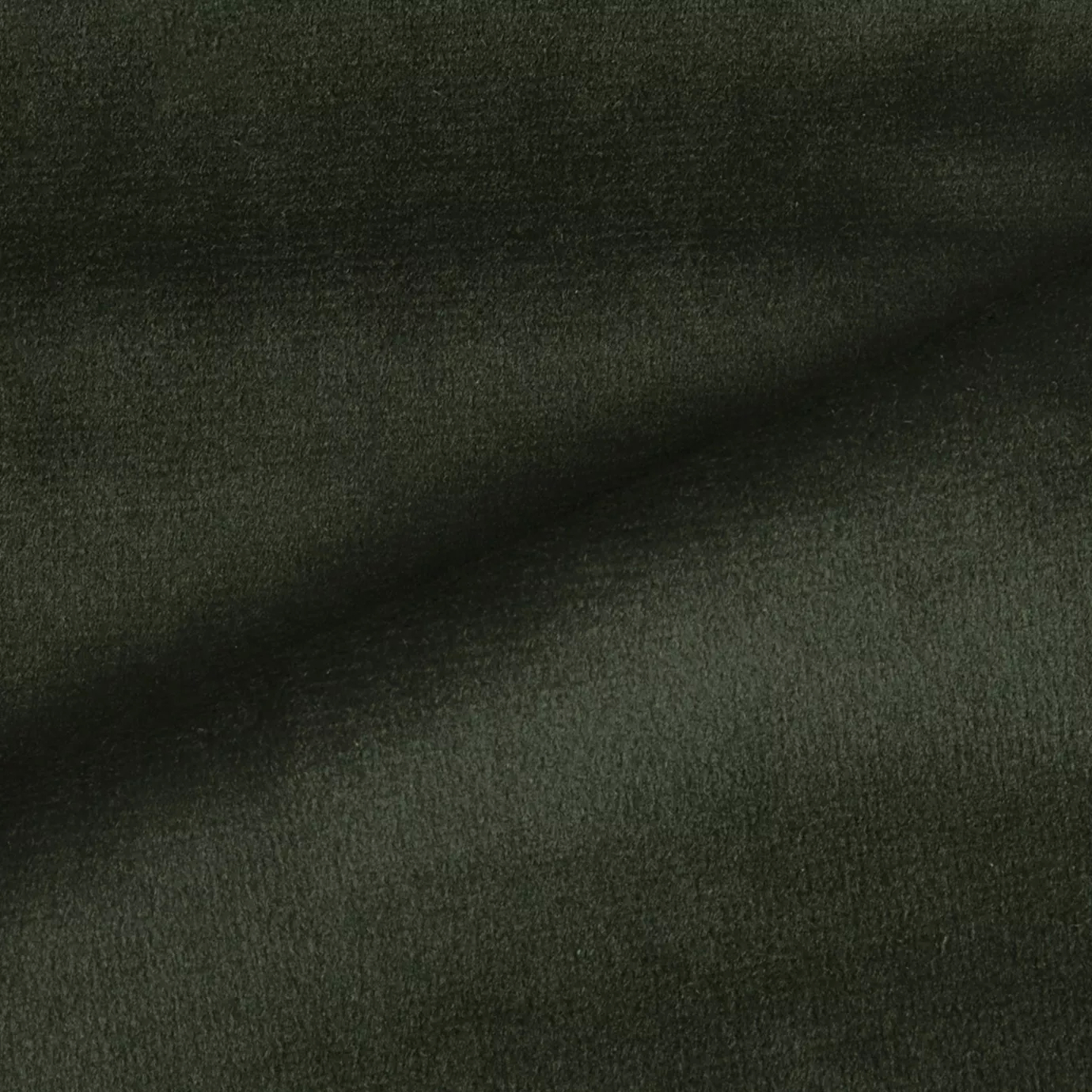 Elegant close-up of a Radiance Velvet Black Forest fabric swatch in a deep and sophisticated dark green tone, showcasing its velvety texture and the gentle folds that highlight its natural and intense elegance.
