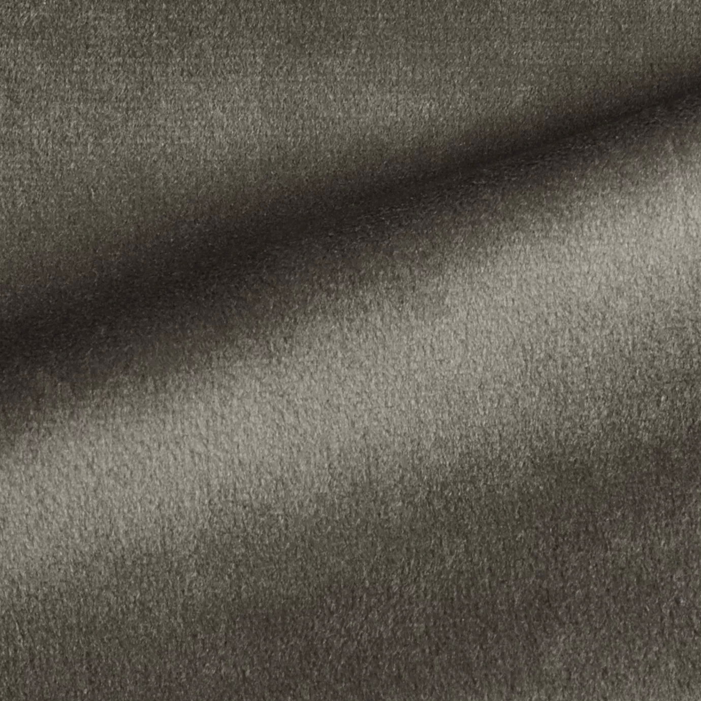 Elegant close-up of a Radiance Velvet Greige Taupe fabric swatch in a medium and sophisticated gray-beige tone, showcasing its velvety texture and a subtle sheen that gives it a feeling of natural and versatile elegance.