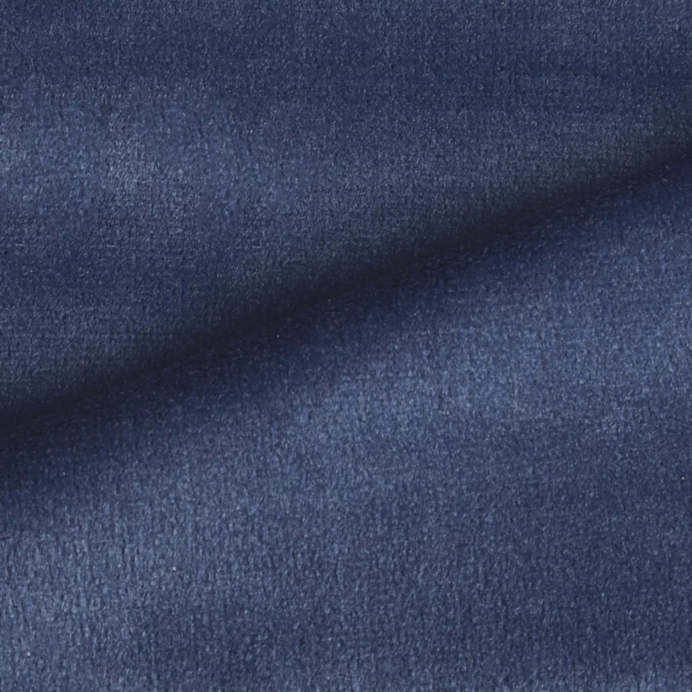 Elegant close-up of a Radiance Velvet Indigo Blue fabric swatch in a rich and sophisticated indigo blue tone, showcasing its velvety texture and the gentle folds that highlight its deep and welcoming elegance.