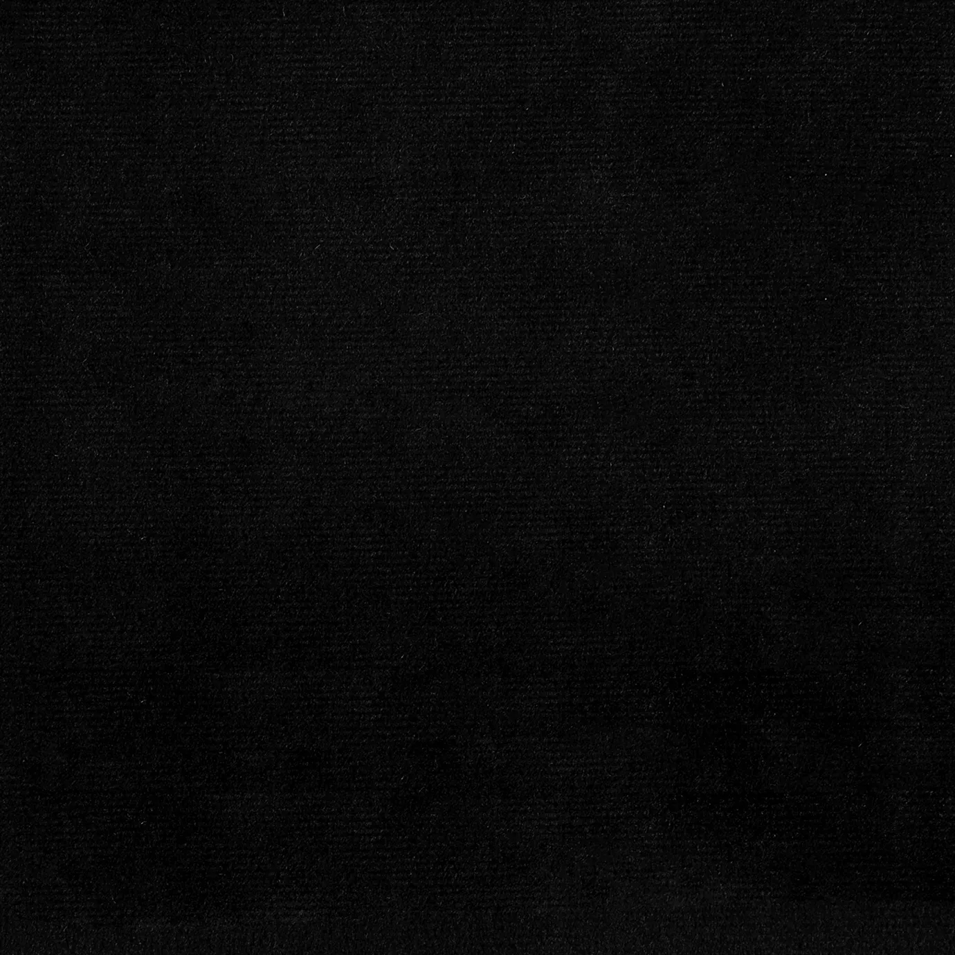 Elegant close-up of a Paris Velvet Black fabric swatch in a deep and soft black tone, showcasing its velvety texture and a subtle sheen that gives it a feeling of comfort and intense elegance.