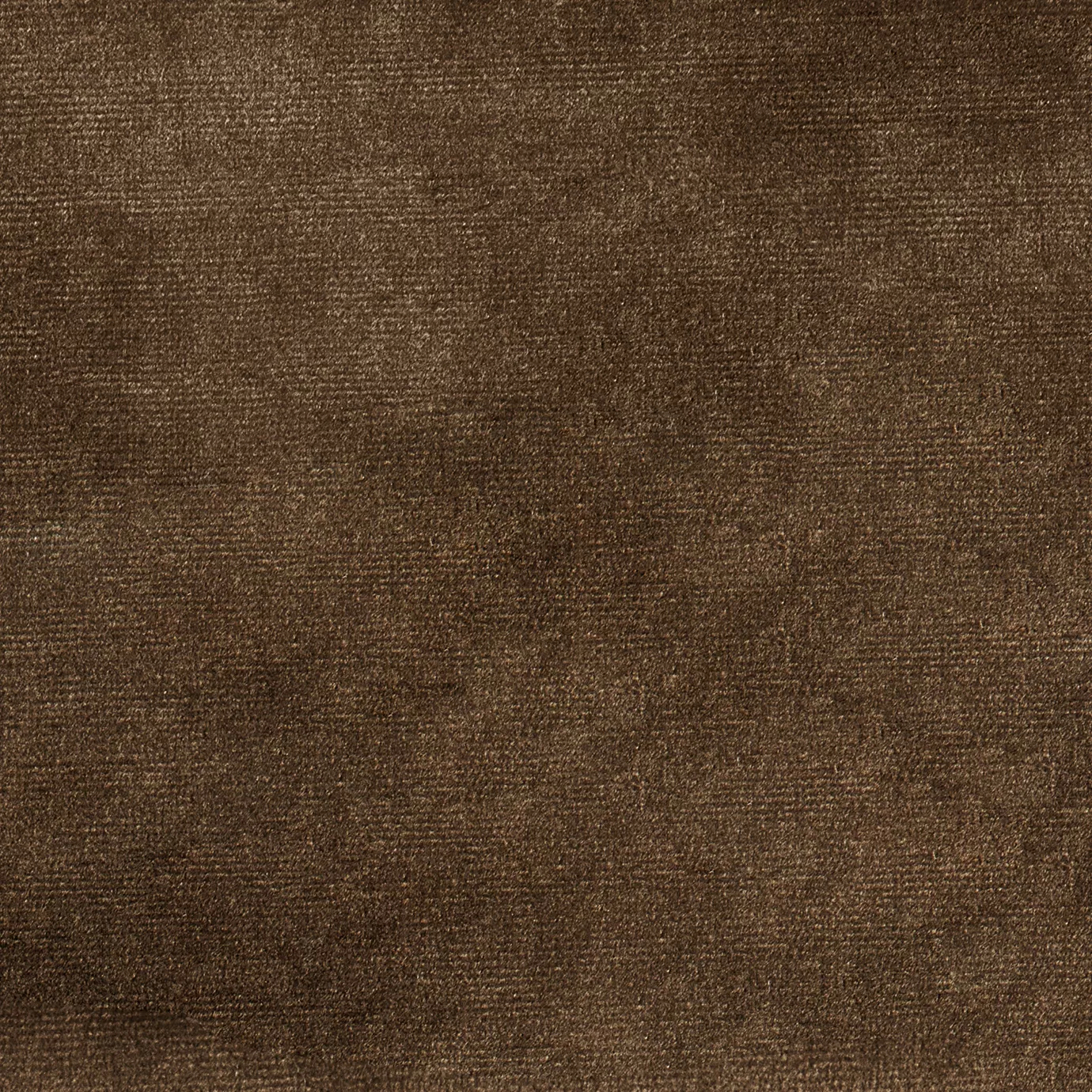 Elegant close-up of a Paris Velvet Cuoio fabric swatch in a soft and warm leather brown tone, showcasing its velvety texture and a subtle sheen that gives it a feeling of comfort and natural, welcoming elegance.