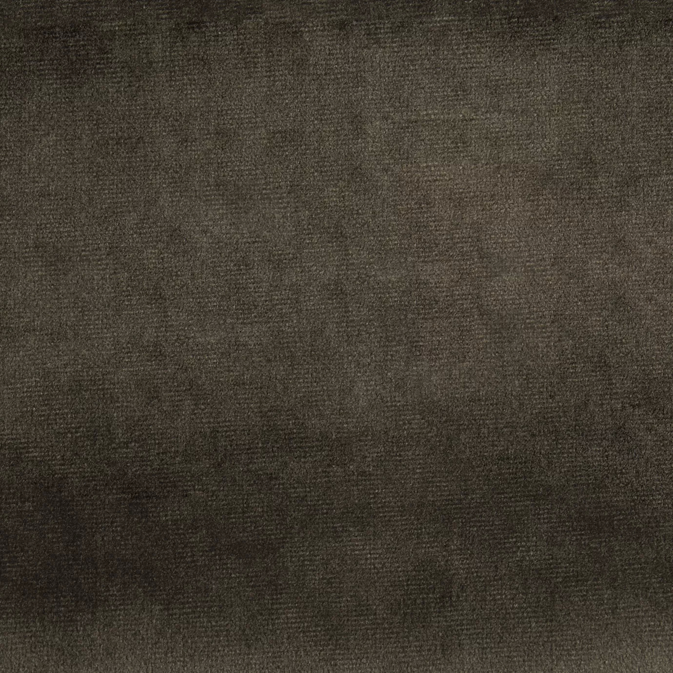 Elegant close-up of a Paris Velvet Ebony fabric swatch in a dark and sophisticated brown tone, showcasing its velvety texture and a subtle sheen that gives it a feeling of comfort and deep elegance.