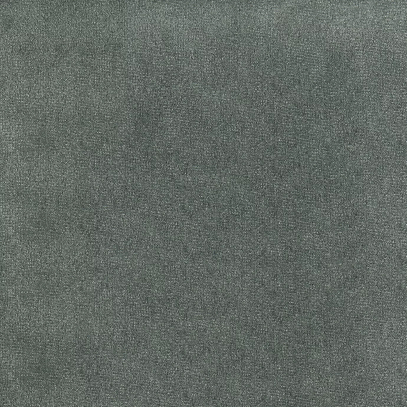 Elegant close-up of a Paris Velvet Safira fabric swatch in a soft and sophisticated gray-blue tone, showcasing its velvety texture and a subtle sheen that gives it a feeling of comfort and natural elegance.