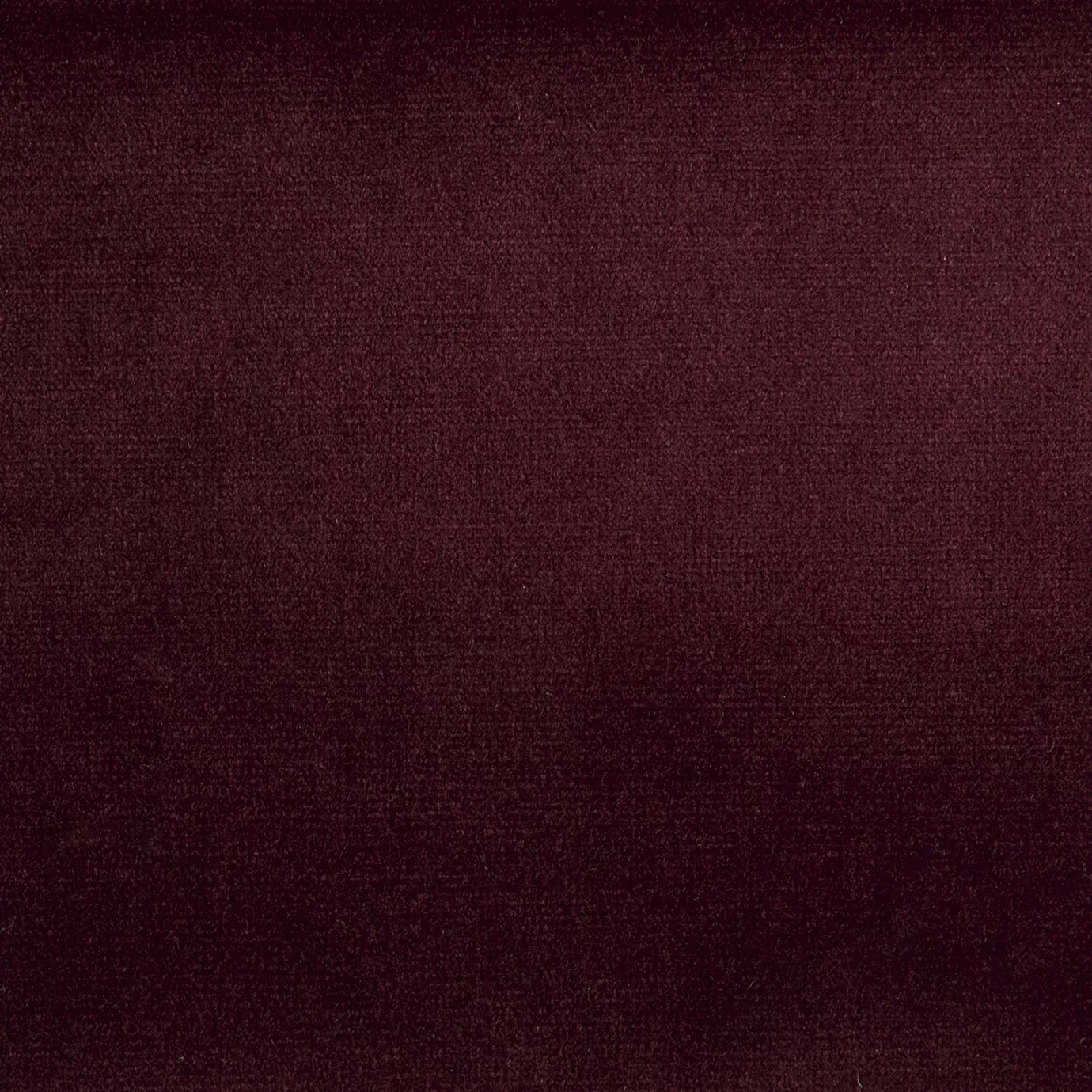 Elegant close-up of a Paris Velvet Wine fabric swatch in a rich and sophisticated wine tone, showcasing its velvety texture and a subtle sheen that gives it a feeling of comfort and deep elegance.
